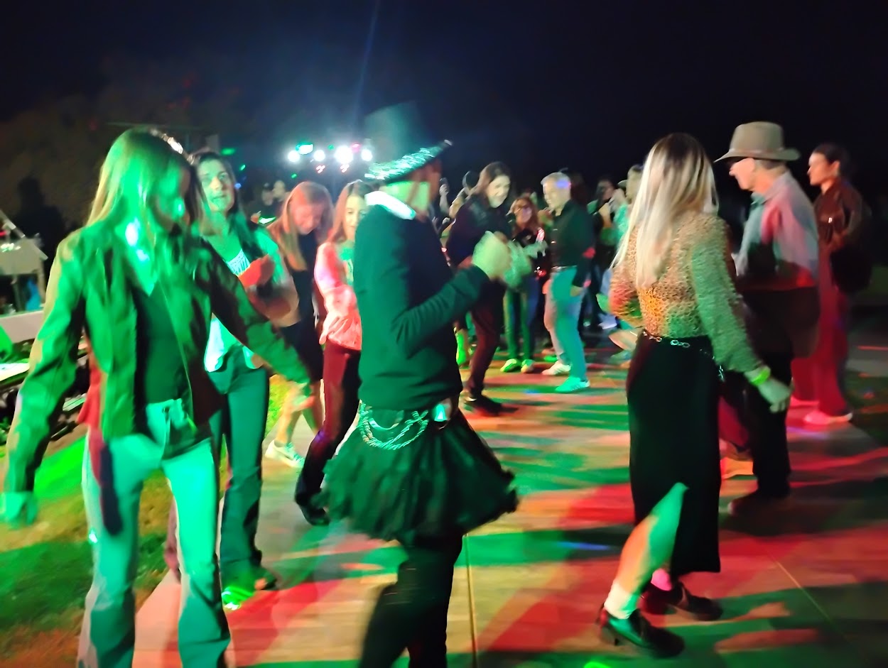 Guests dancing at an outdoor live performance