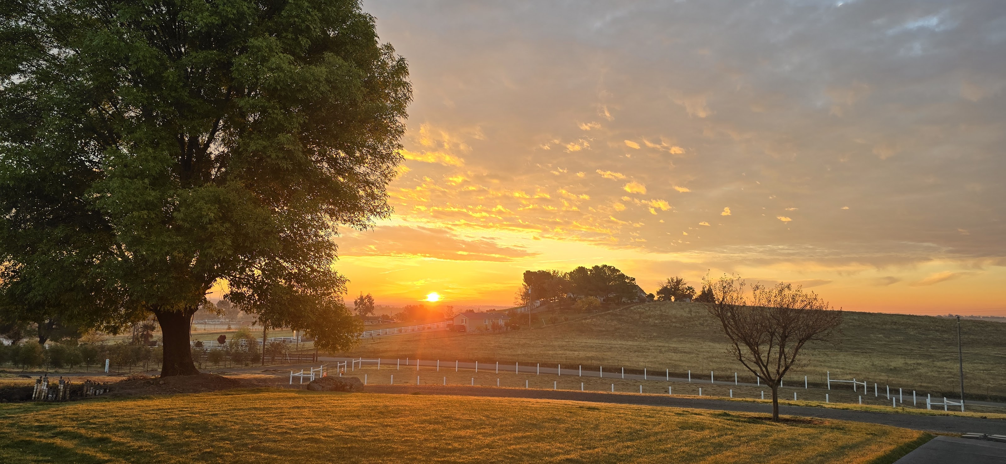 Warm sunset across the ranch landscape